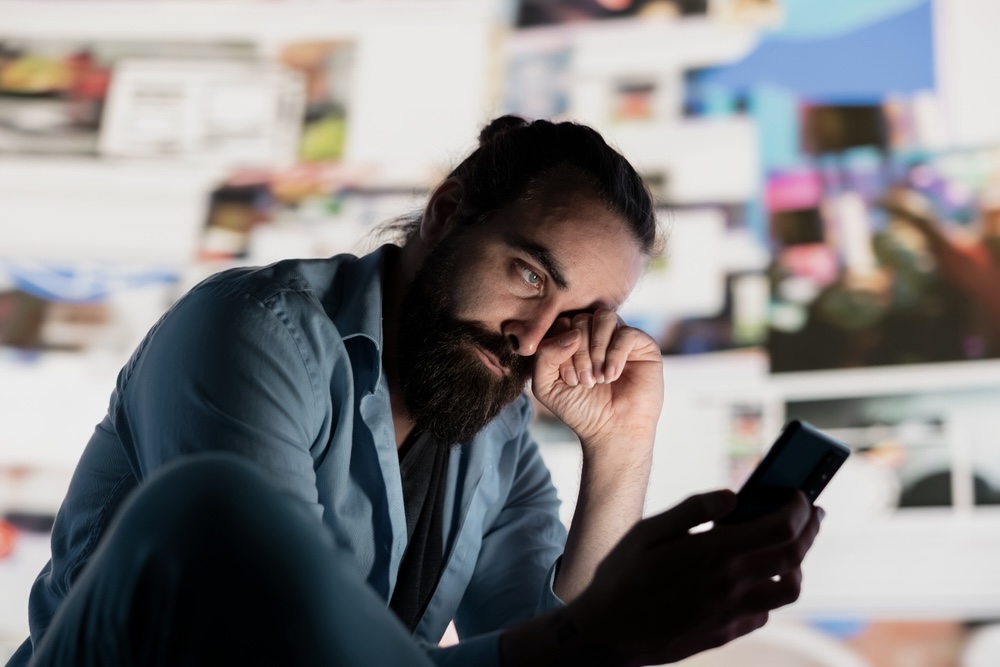 Man reading depression quotes on his phone