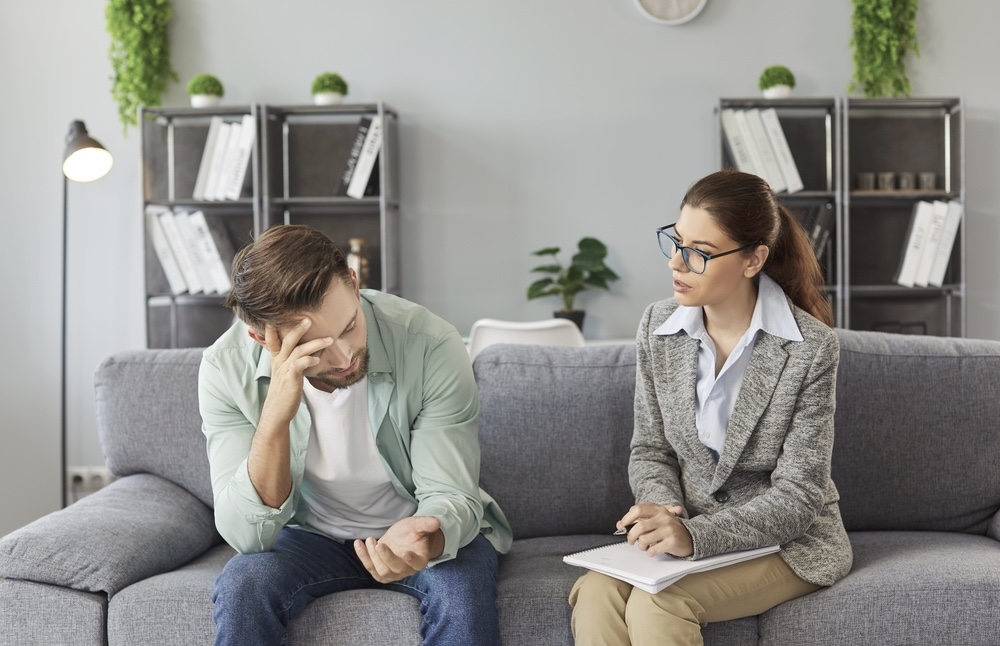 Man with anxiety consulting with a mental health specialist in Lancaster CA