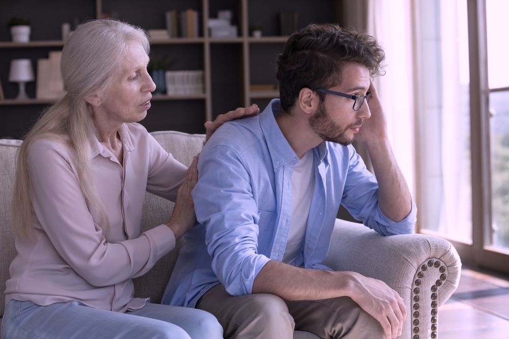 Mother supporting adult son dealing with depression