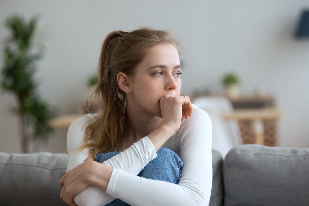 Young female wondering the difference between sadness and depression